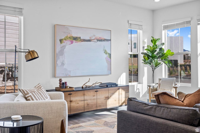 488 West Greenstone Pl Street, Unit 1010 St. George, UT 84790 - Photo 19 of 34 Bright living area featuring high ceilings, multiple large windows, and wood-finish flooring
