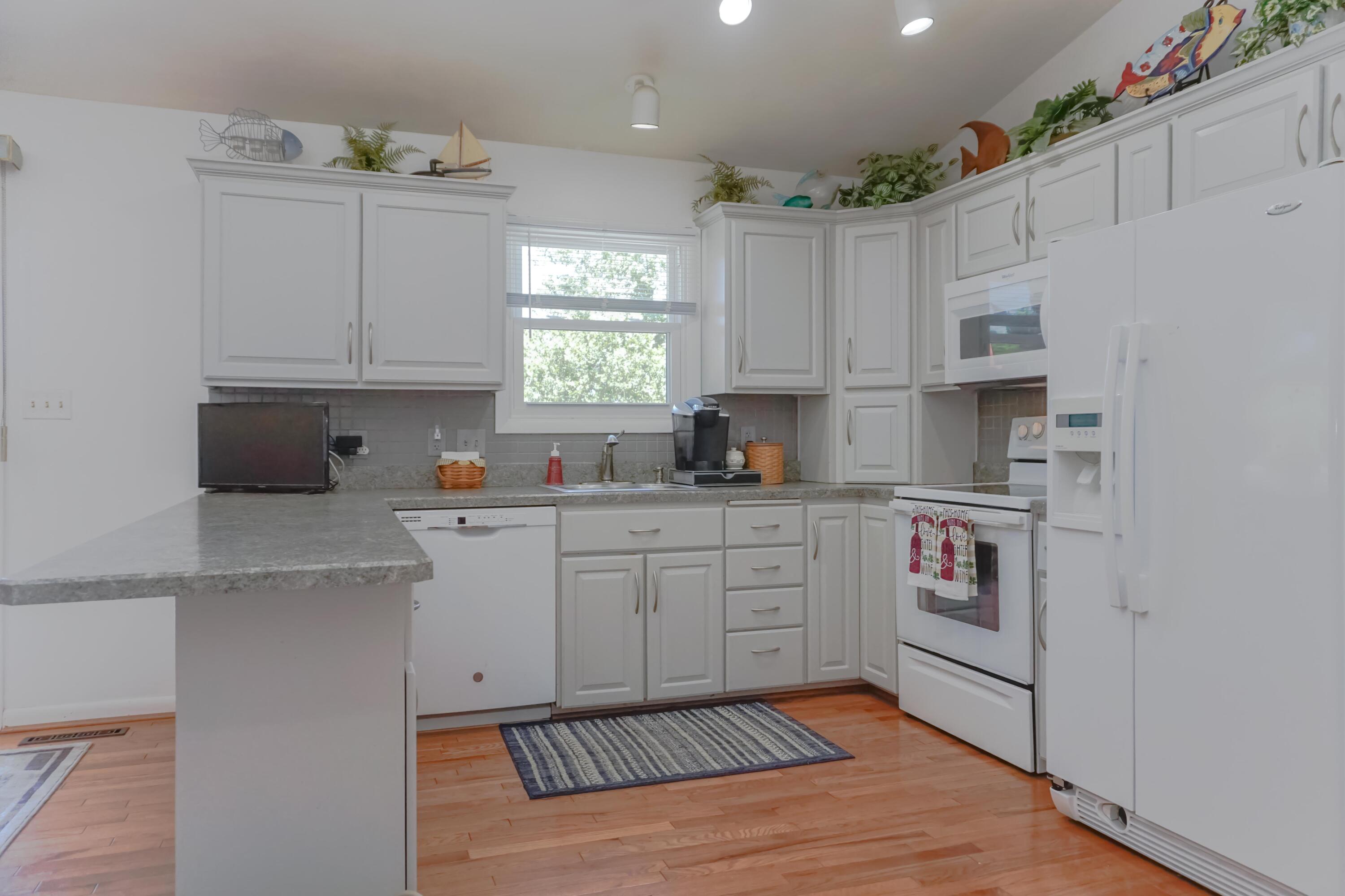 497 Cedar Ridge Road Union Hall, VA 24176 - Photo 13 of 31 a kitchen with stainless steel appliances white cabinets a sink and a stove