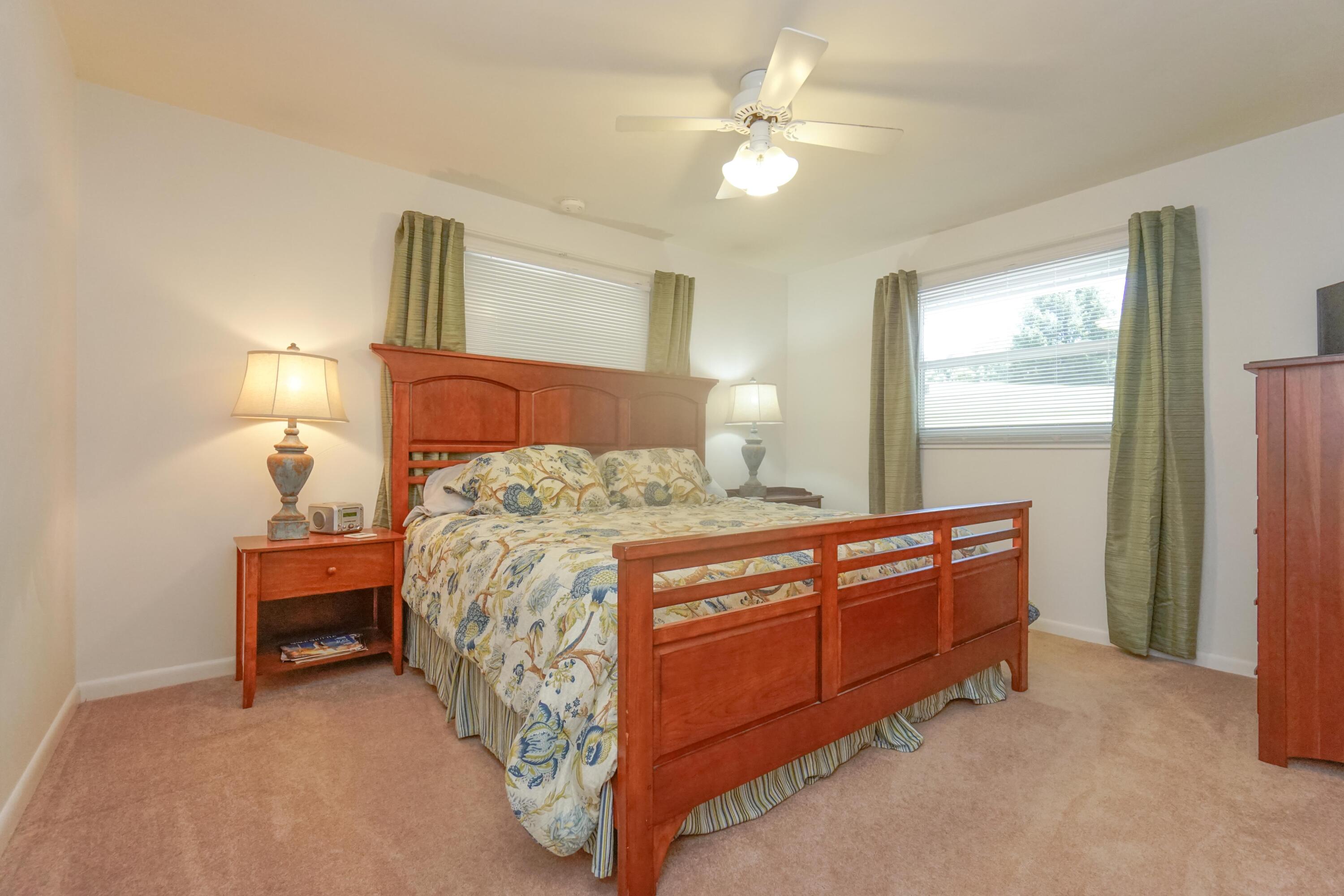 497 Cedar Ridge Road Union Hall, VA 24176 - Photo 15 of 31 a bed room with a bed and a chandelier