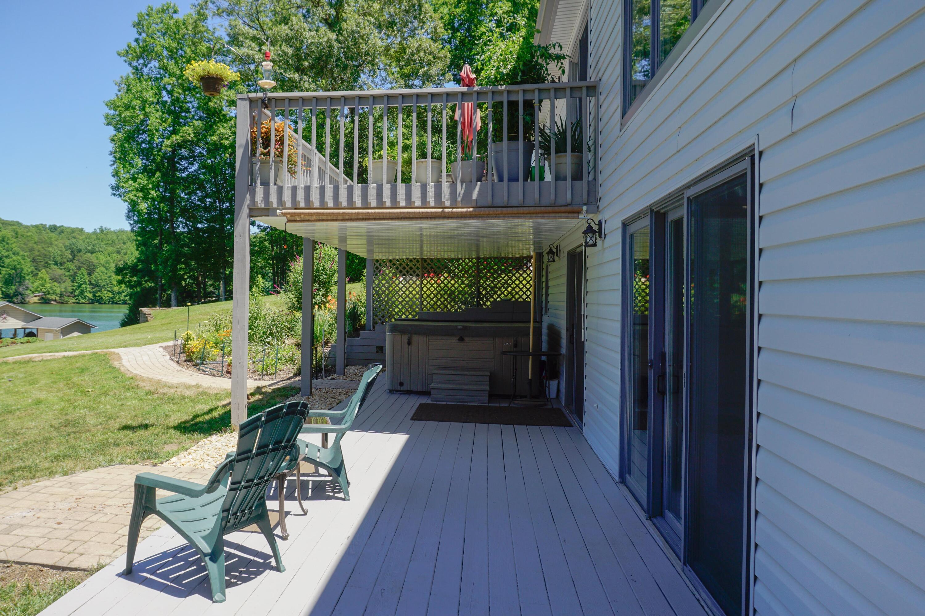 497 Cedar Ridge Road Union Hall, VA 24176 - Photo 26 of 31 a view of balcony with wooden floor and outdoor seating