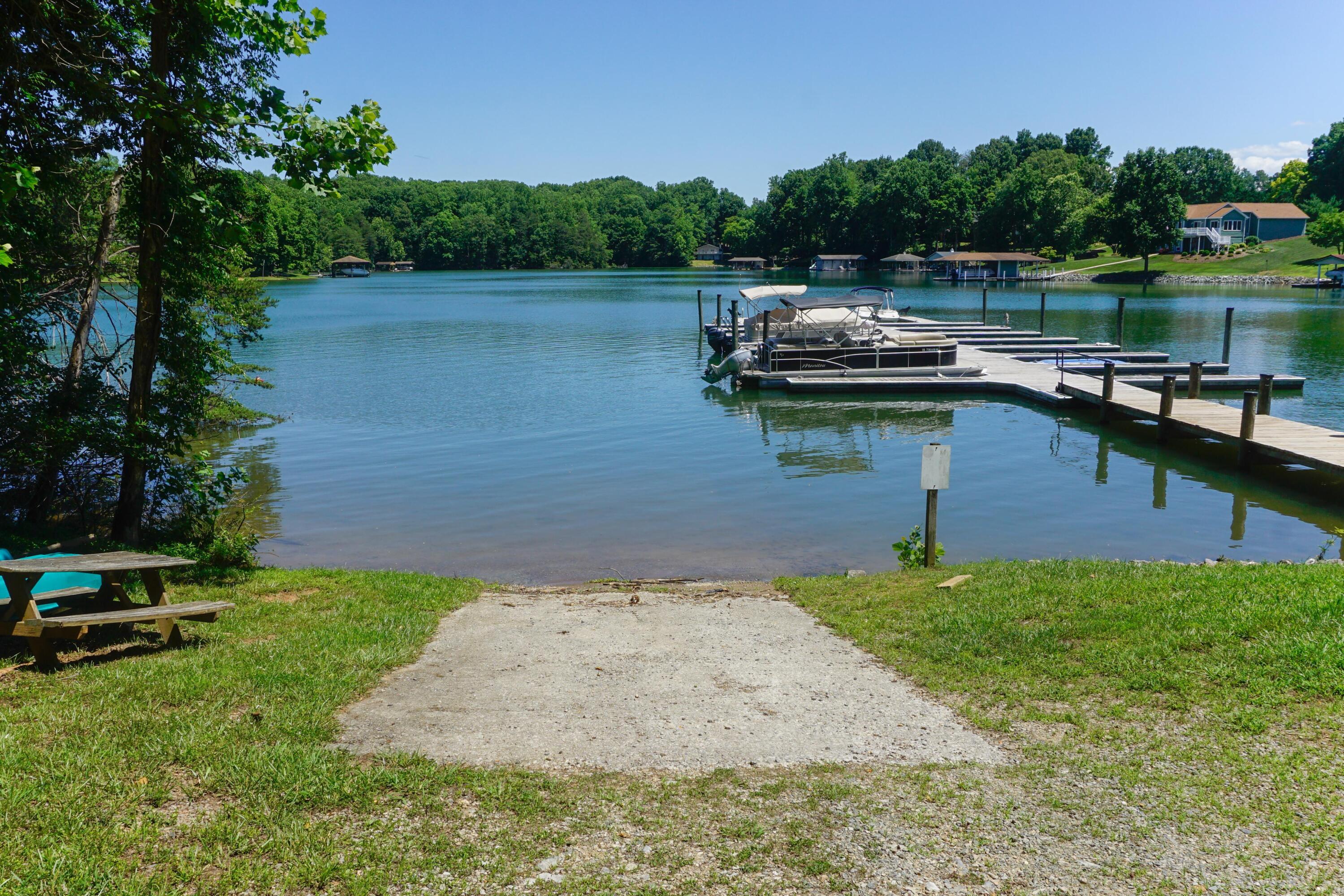 497 Cedar Ridge Road Union Hall, VA 24176 - Photo 30 of 31 a view of a lake with houses in the back
