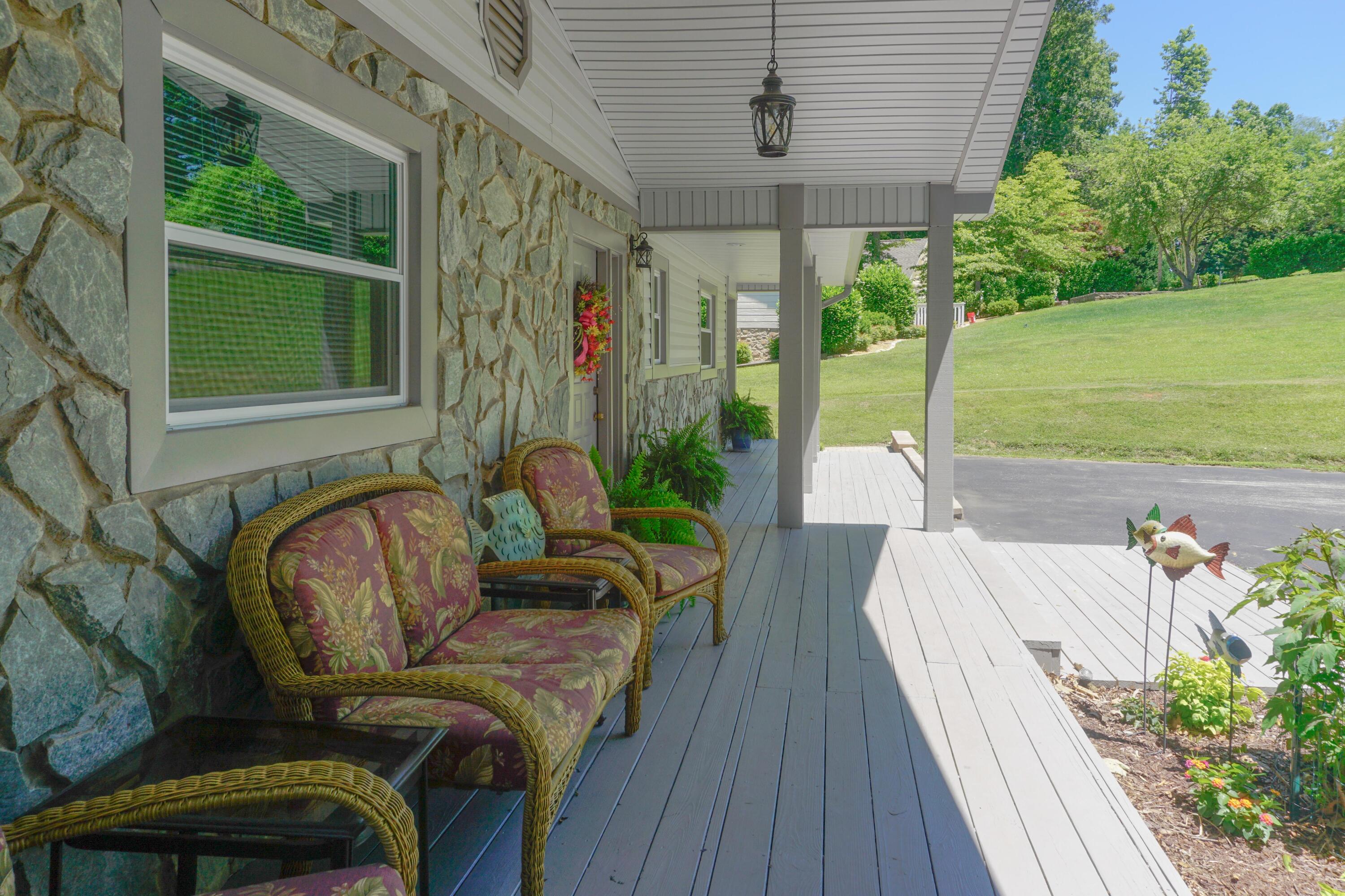 497 Cedar Ridge Road Union Hall, VA 24176 - Photo 9 of 31 a view of a porch with furniture and a yard