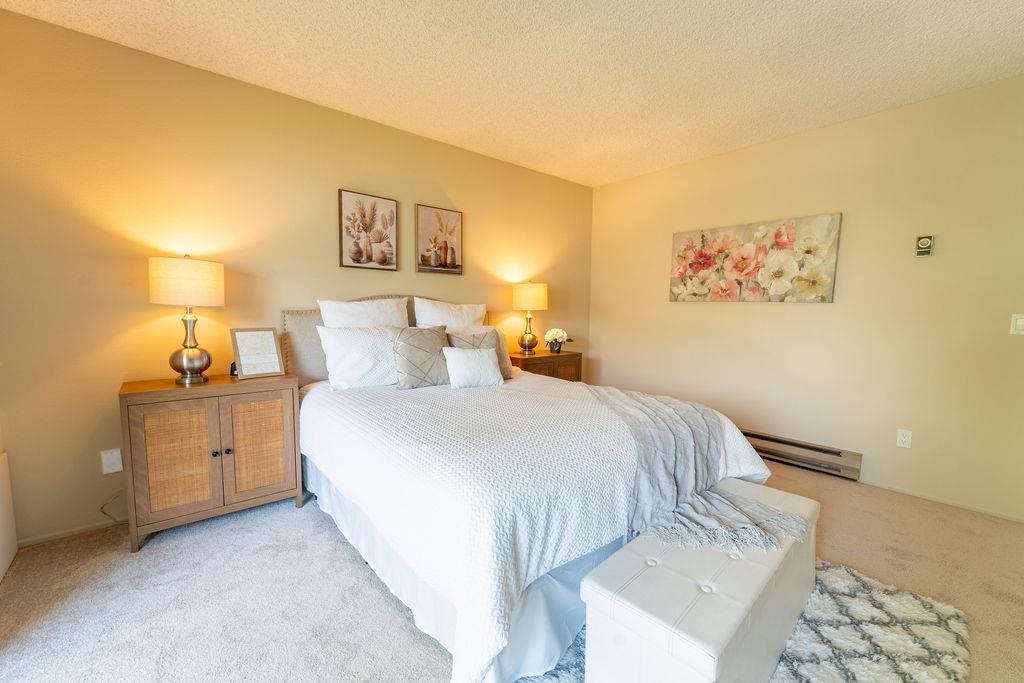1005 Golf Course Drive Rohnert Park, CA 94928 - Photo 12 of 44 a bedroom with a bed and lamp