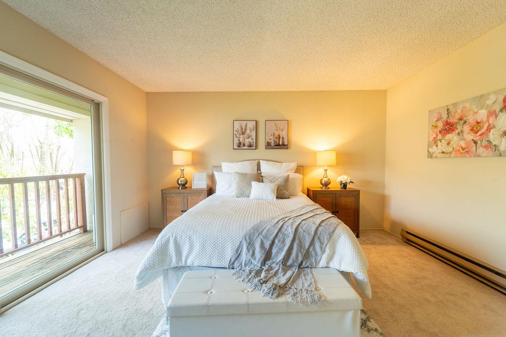 1005 Golf Course Drive Rohnert Park, CA 94928 - Photo 13 of 44 a bedroom with a bed and a painting on the wall