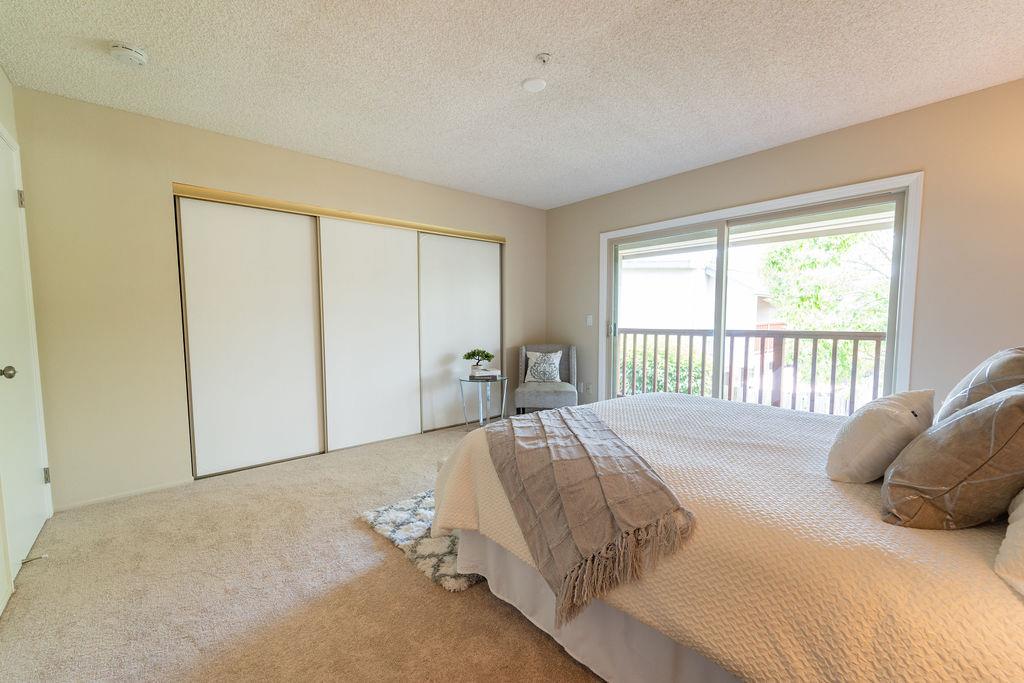 1005 Golf Course Drive Rohnert Park, CA 94928 - Photo 14 of 44 a bed sitting in a bedroom next to a window