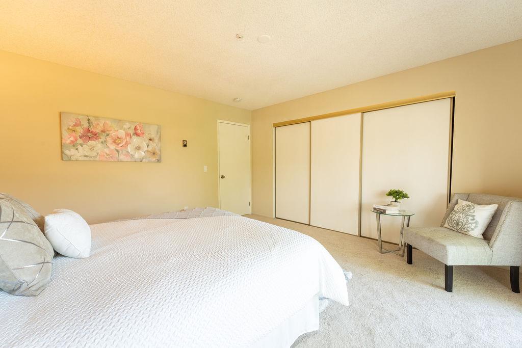 1005 Golf Course Drive Rohnert Park, CA 94928 - Photo 15 of 44 a spacious bedroom with a bed and a couch