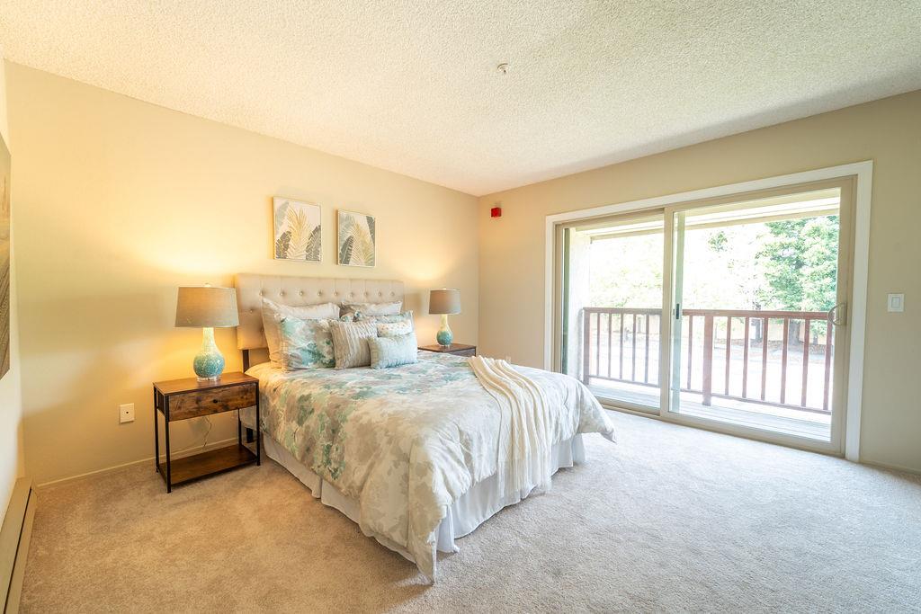 1005 Golf Course Drive Rohnert Park, CA 94928 - Photo 20 of 44 a spacious bedroom with a bed and a window
