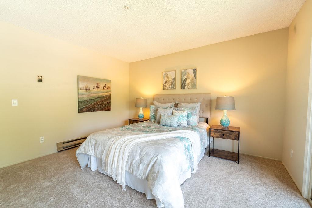 1005 Golf Course Drive Rohnert Park, CA 94928 - Photo 21 of 44 a bedroom with a bed and a painting on the wall