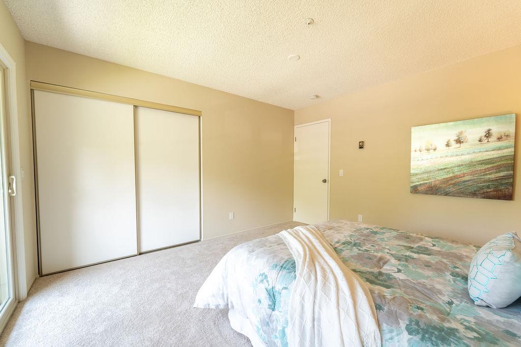 1005 Golf Course Drive Rohnert Park, CA 94928 - Photo 22 of 44 a bedroom with a bed and painting on the wall