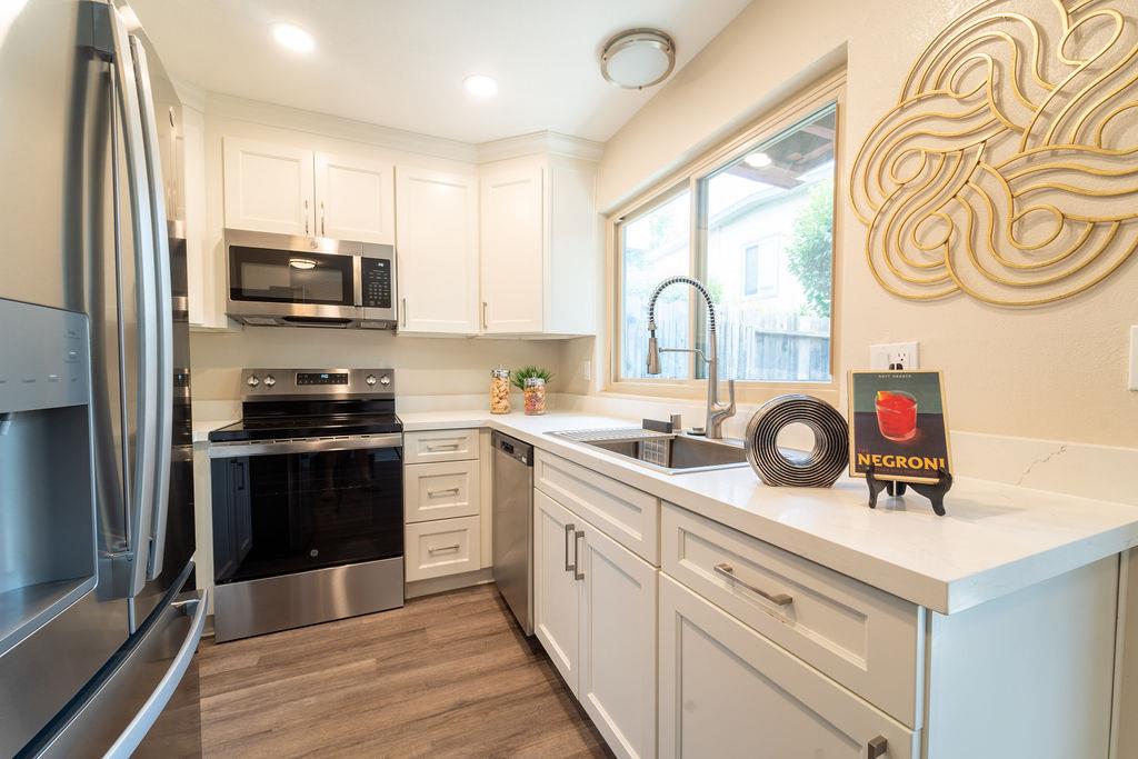 1005 Golf Course Drive Rohnert Park, CA 94928 - Photo 5 of 44 a kitchen with a sink a stove and cabinets