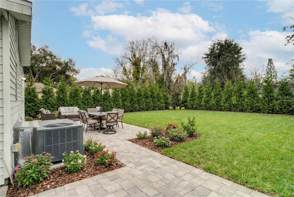 330 East Story Road Winter Garden, FL 34787 - Photo 19 of 21 a view of a table and chairs in the garden