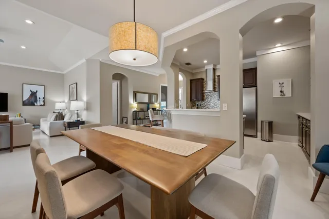 a large kitchen with a table and chairs