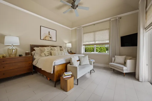 a bedroom with a bed and a couch