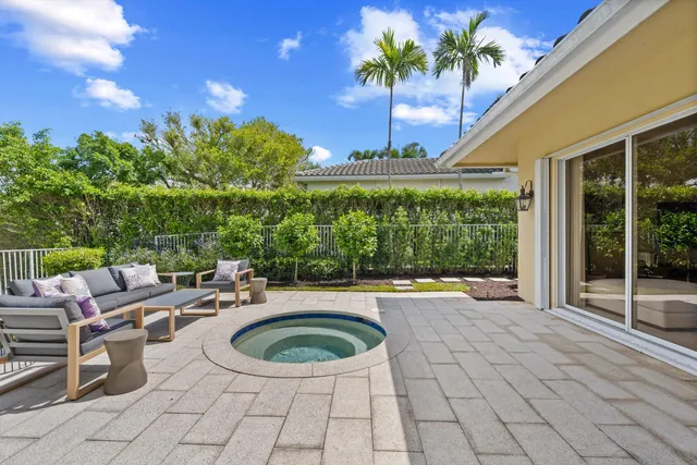 a view of a swimming pool with a patio