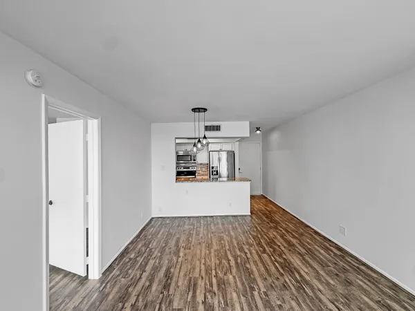 a kitchen with stainless steel appliances a refrigerator stove and oven