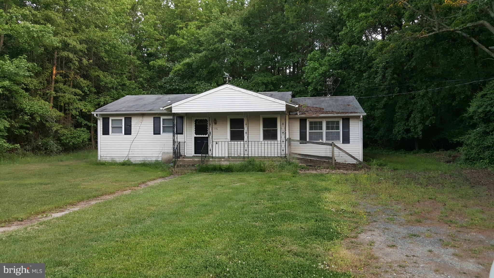 116 Riverside Drive Chester, MD 21619 - Photo 1 of 1 a front view of a house with a garden