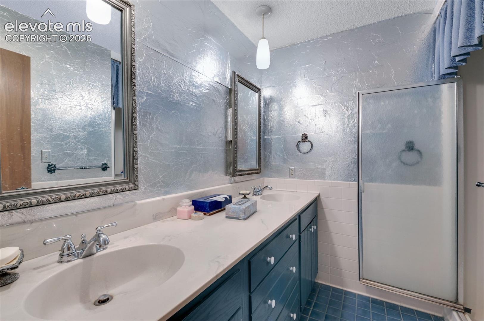 24975 Sanborn Road Calhan, CO 80808 - Photo 31 of 50 Hall bath with double vanity and shower