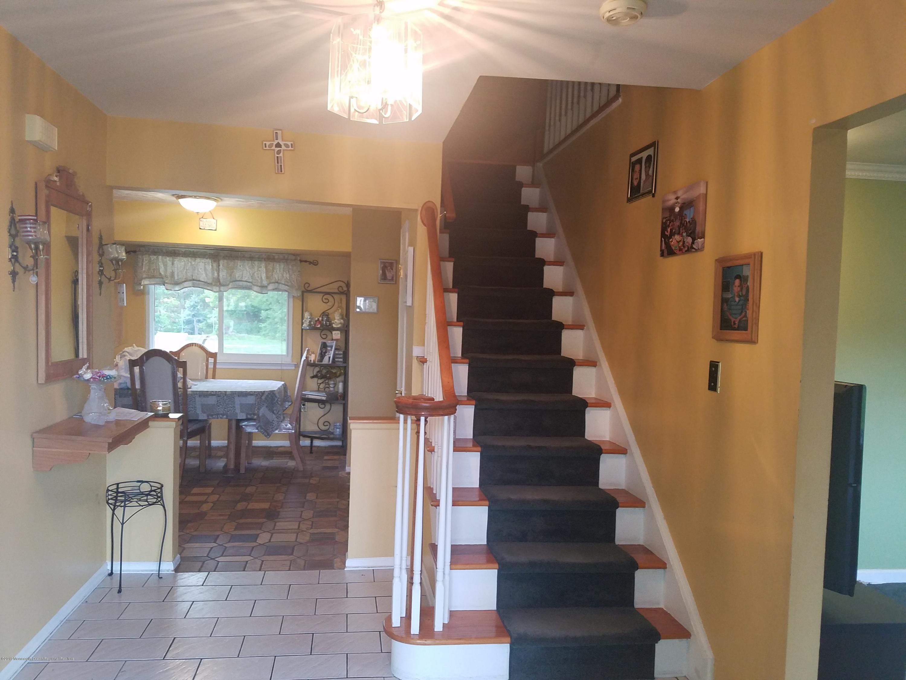30 Rothbard Road Hazlet, NJ 07730 - Photo 2 of 20 a view of entryway and hall with dining room