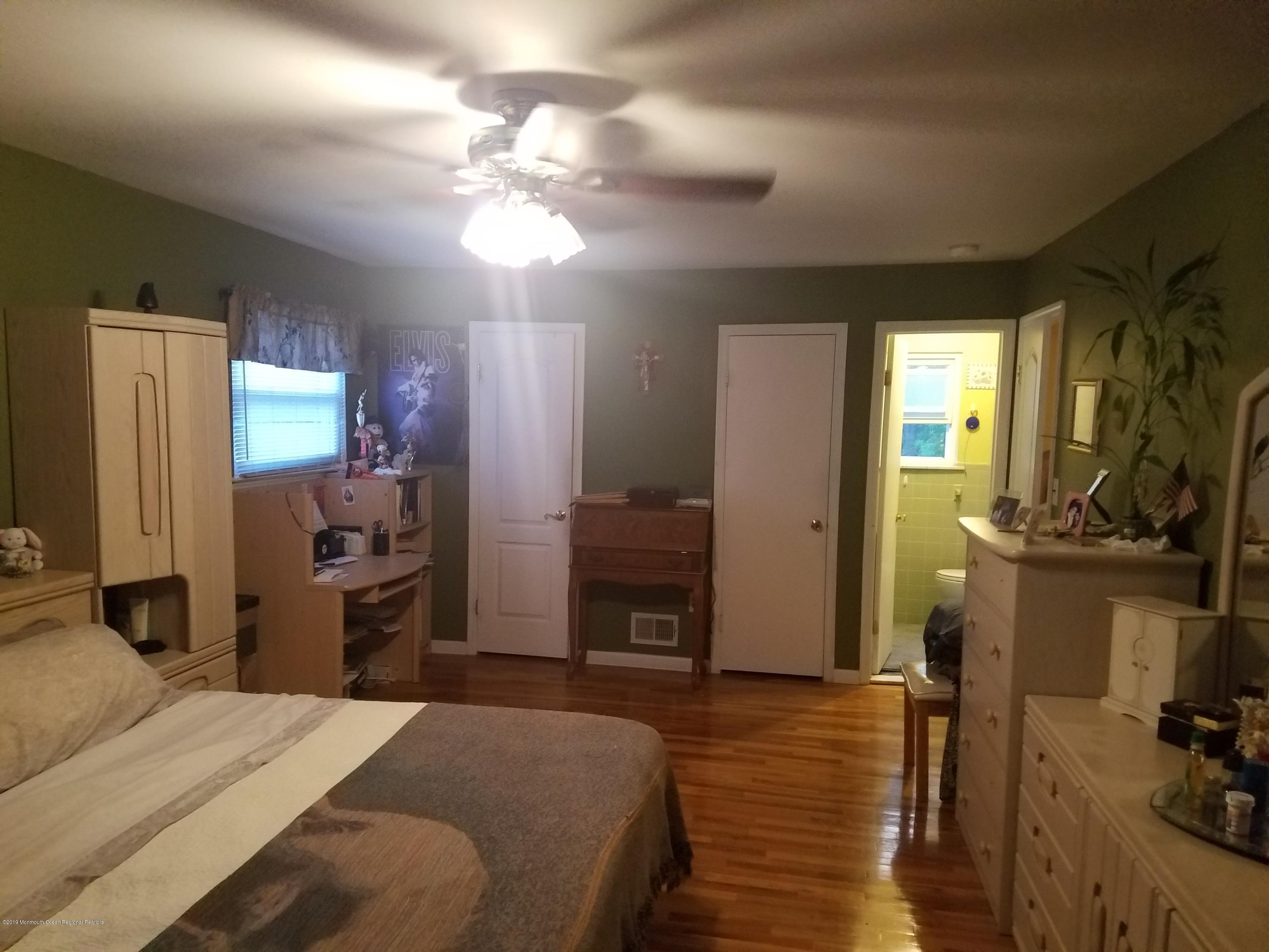 30 Rothbard Road Hazlet, NJ 07730 - Photo 11 of 20 a bedroom with a bed and a television