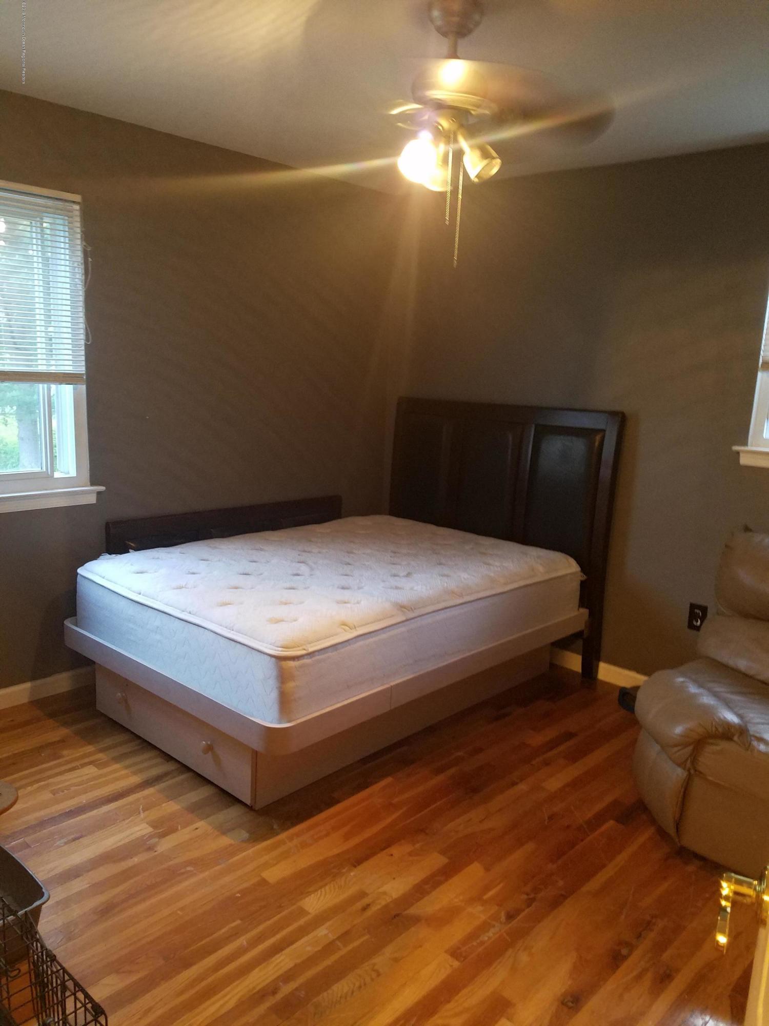 30 Rothbard Road Hazlet, NJ 07730 - Photo 12 of 20 a bedroom with a bed and window