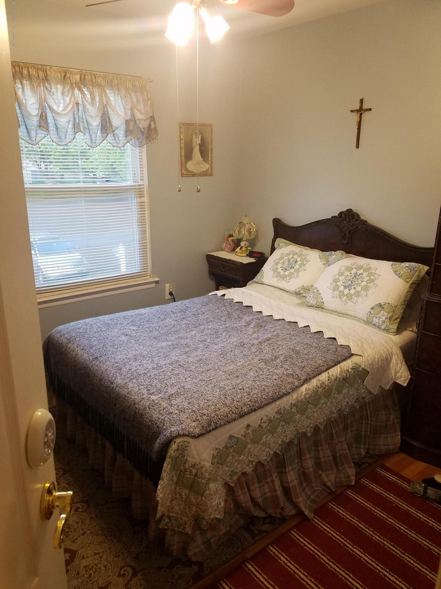 30 Rothbard Road Hazlet, NJ 07730 - Photo 13 of 20 a bedroom with a bed and a window