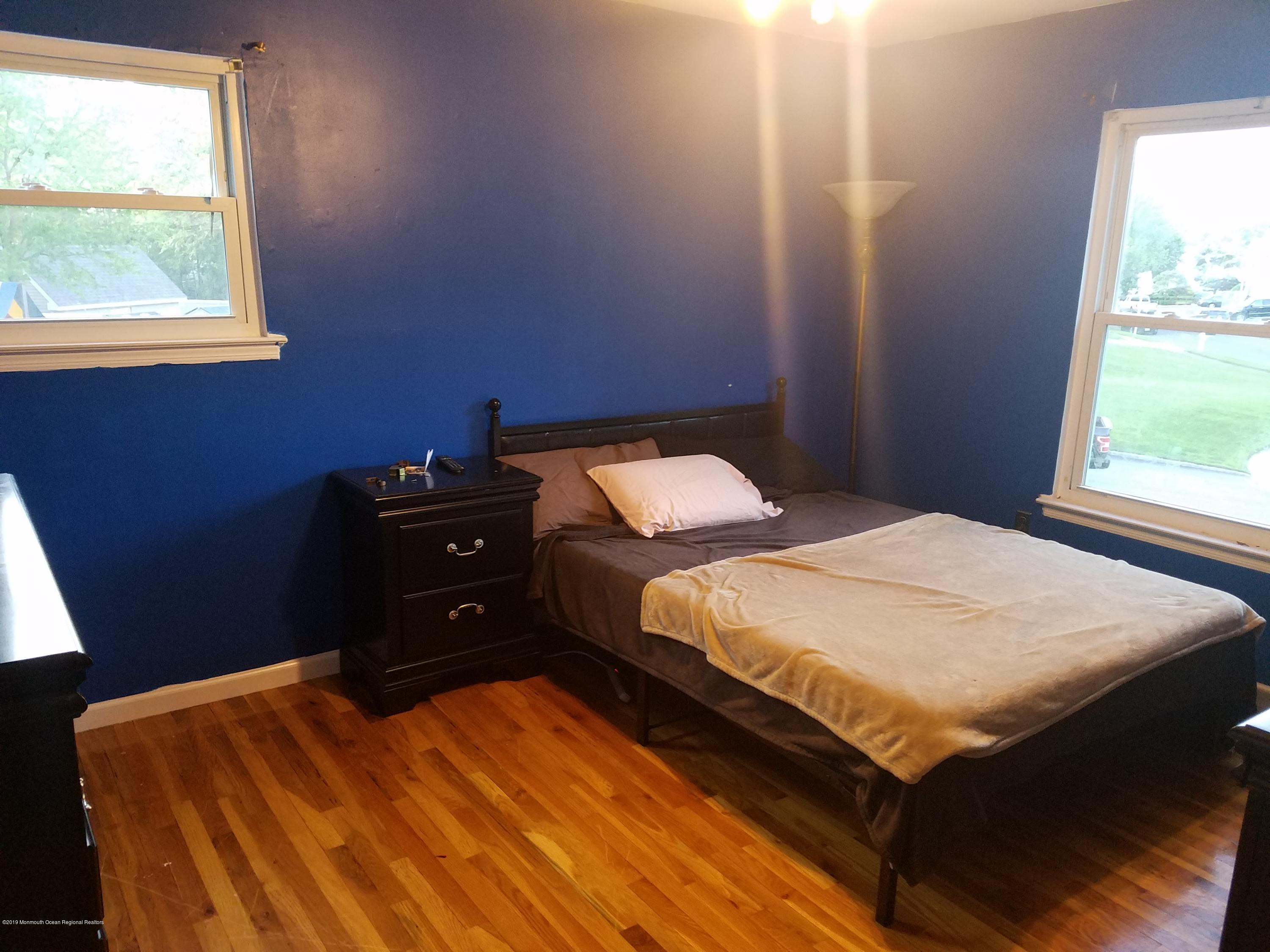 30 Rothbard Road Hazlet, NJ 07730 - Photo 14 of 20 a bedroom with a bed and a window
