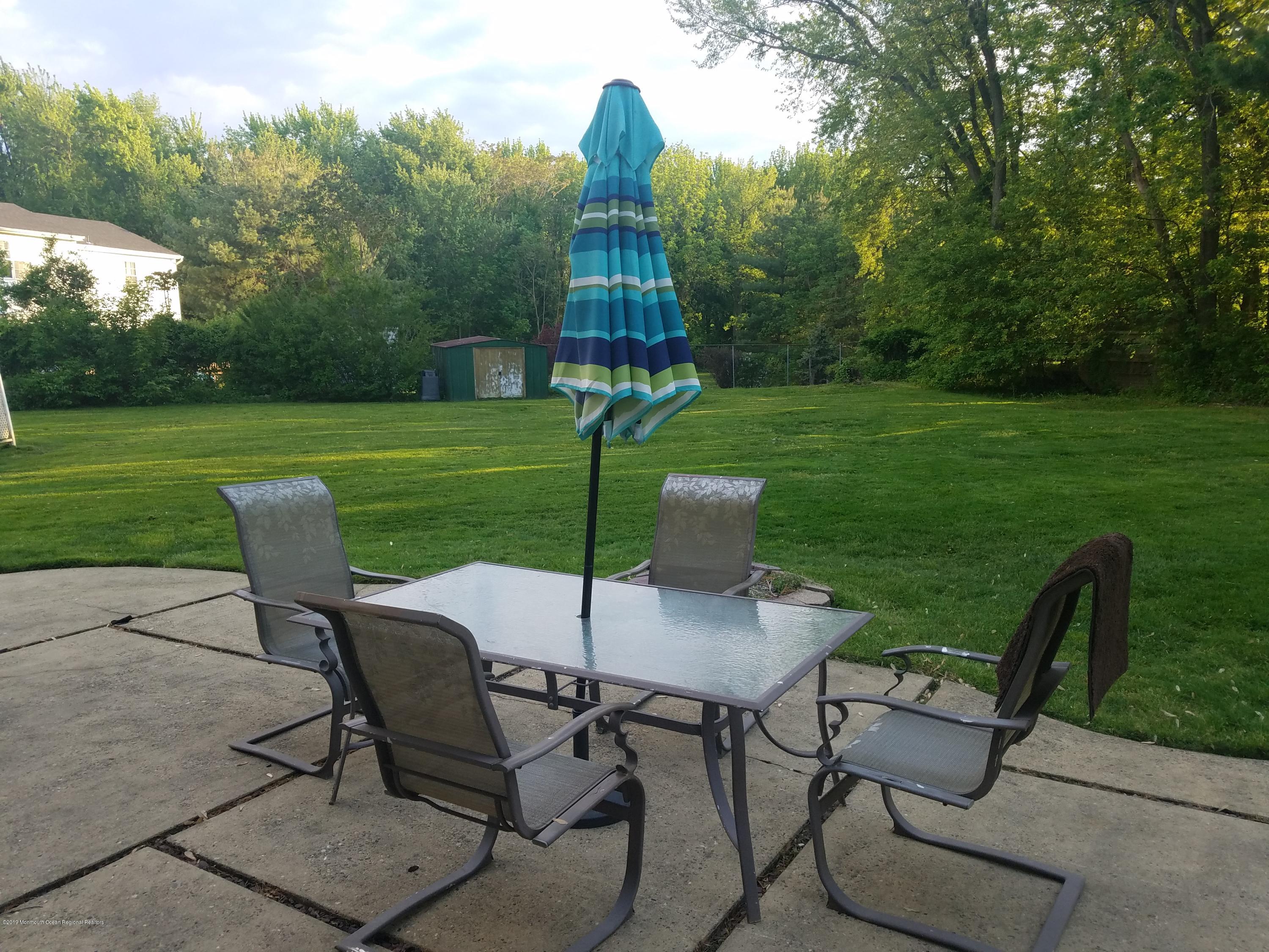 30 Rothbard Road Hazlet, NJ 07730 - Photo 19 of 20 a view of a house with backyard sitting area and garden