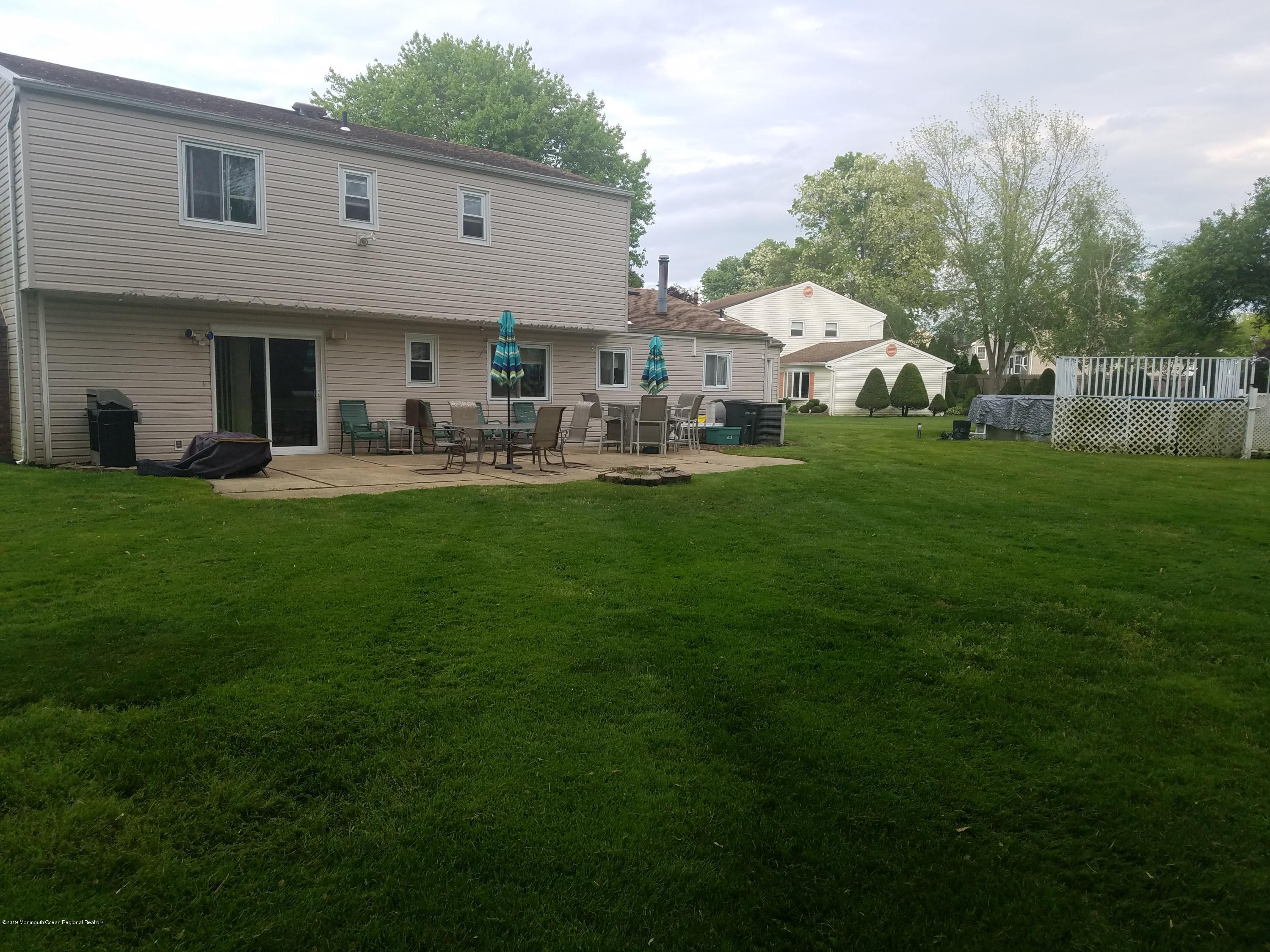 30 Rothbard Road Hazlet, NJ 07730 - Photo 20 of 20 a front view of a house with swimming pool having outdoor seating