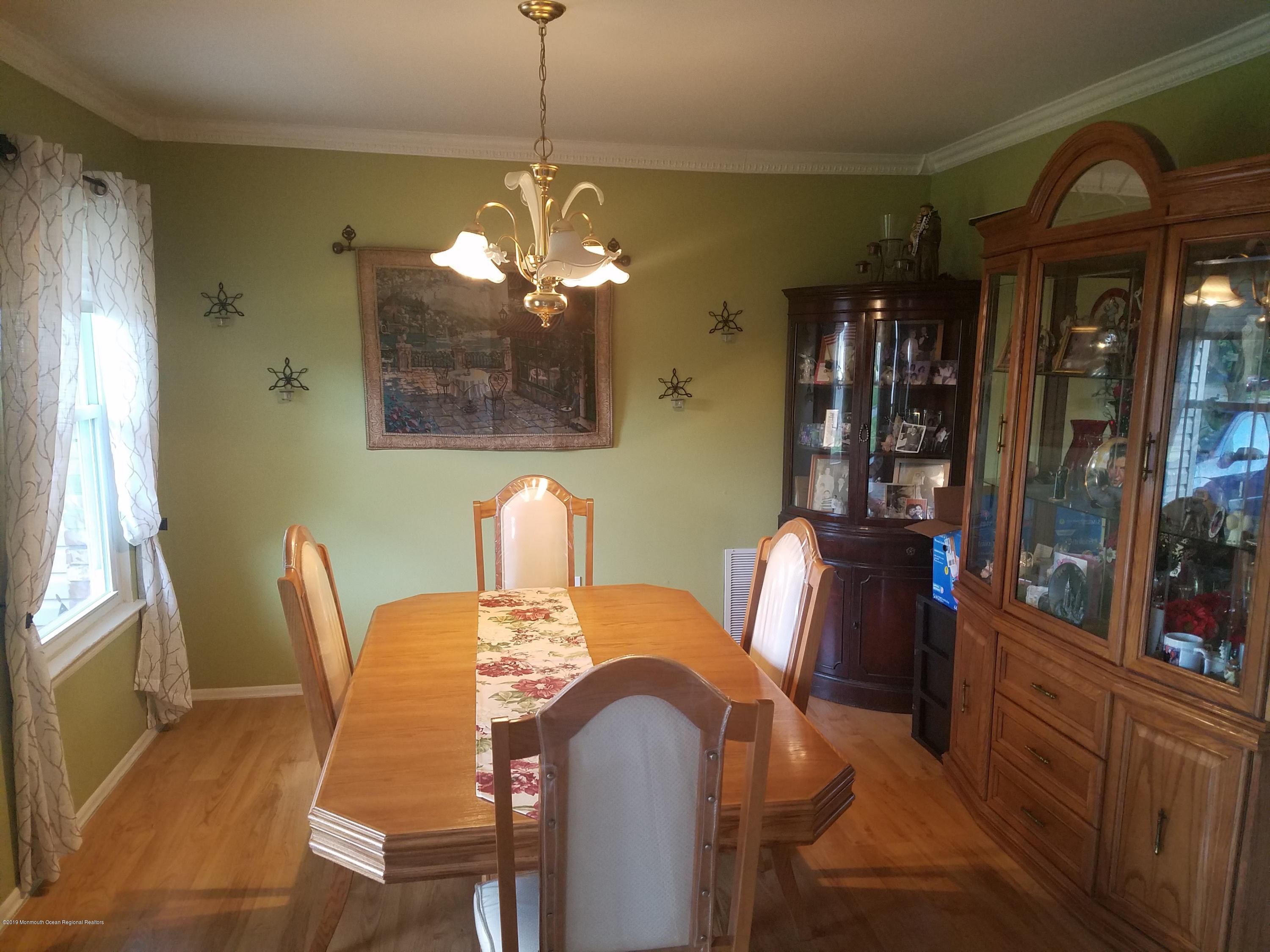 30 Rothbard Road Hazlet, NJ 07730 - Photo 5 of 20 a view of a dining room with furniture and chandelier
