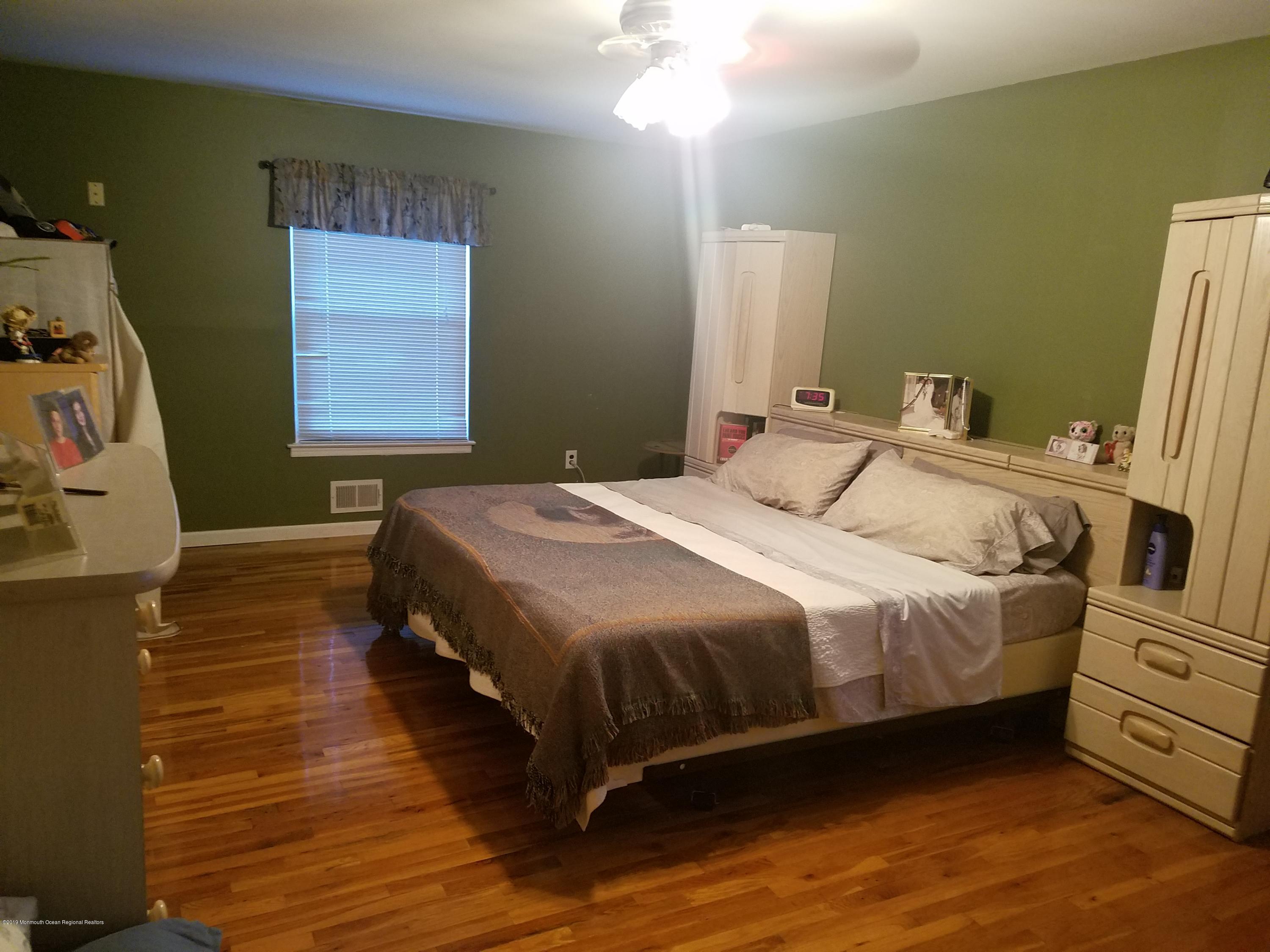 30 Rothbard Road Hazlet, NJ 07730 - Photo 10 of 20 a bedroom with a bed and a window