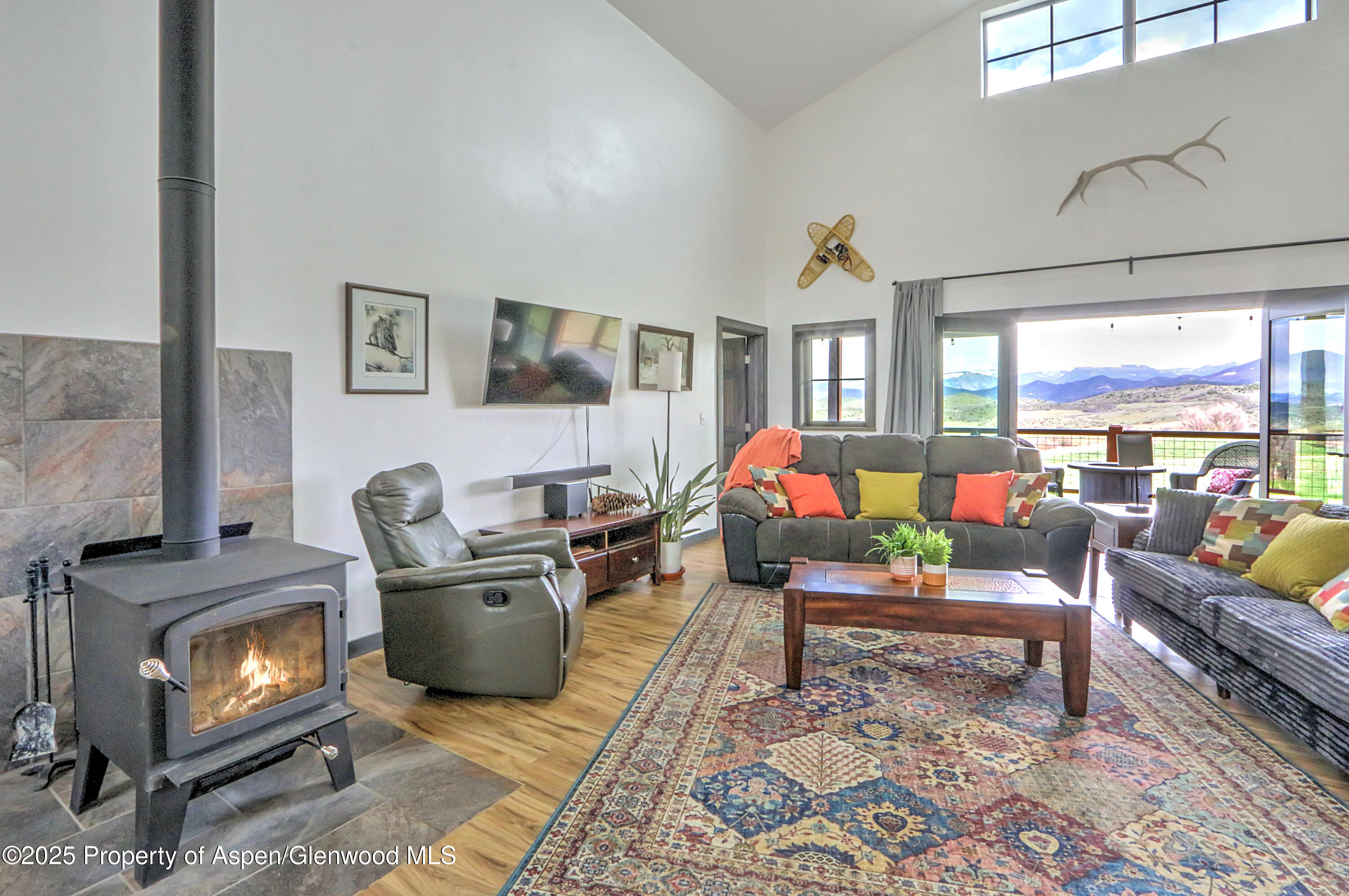 7315 County Road 312 New Castle, CO 81647 - Photo 14 of 75 a living room with furniture a flat screen tv and a fireplace