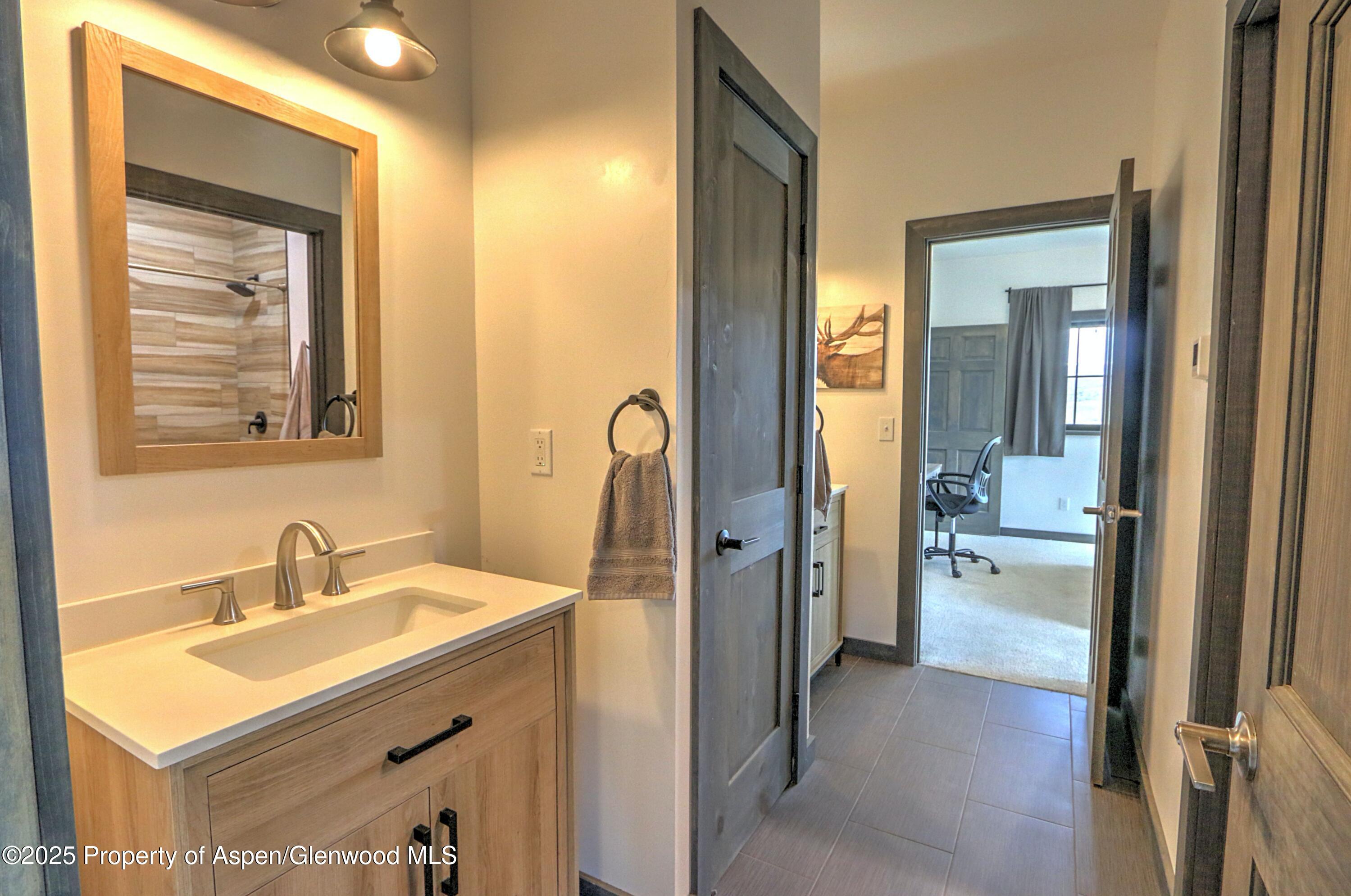 7315 County Road 312 New Castle, CO 81647 - Photo 22 of 75 a bathroom with a sink and a mirror