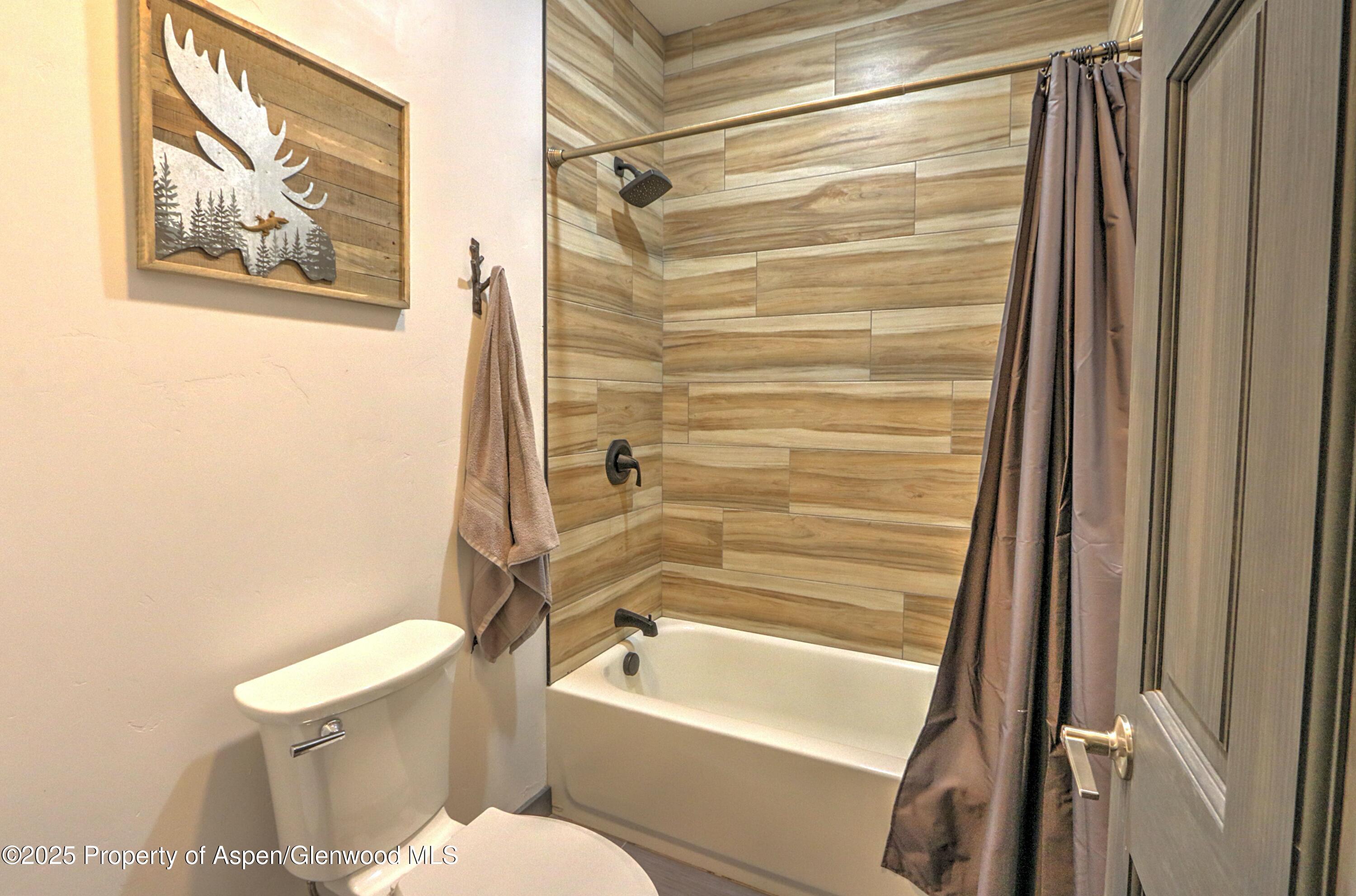 7315 County Road 312 New Castle, CO 81647 - Photo 24 of 75 a bathroom with a toilet and a bathtub