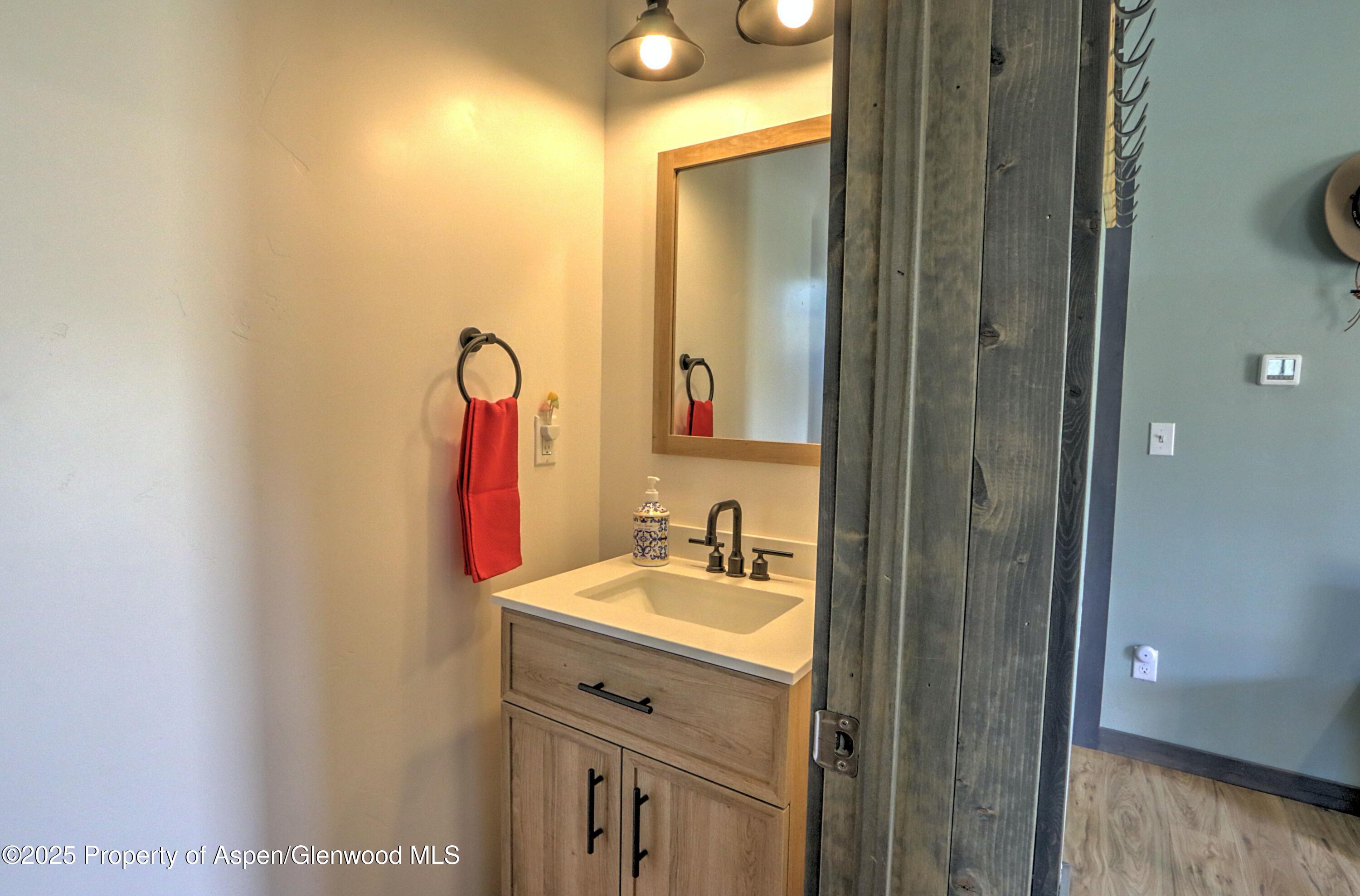 7315 County Road 312 New Castle, CO 81647 - Photo 27 of 75 a bathroom with a sink and a mirror