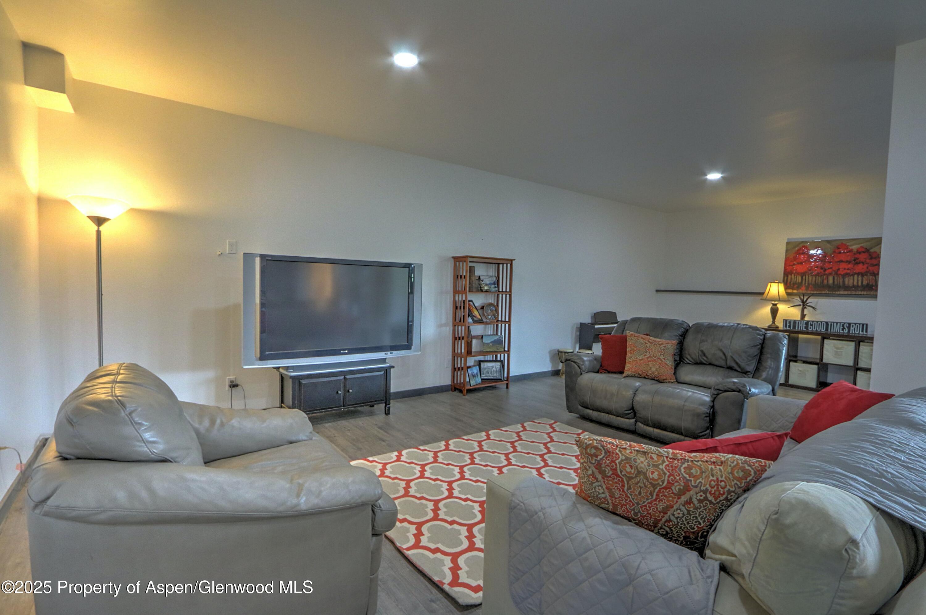 7315 County Road 312 New Castle, CO 81647 - Photo 29 of 75 a living room with furniture and a flat screen tv