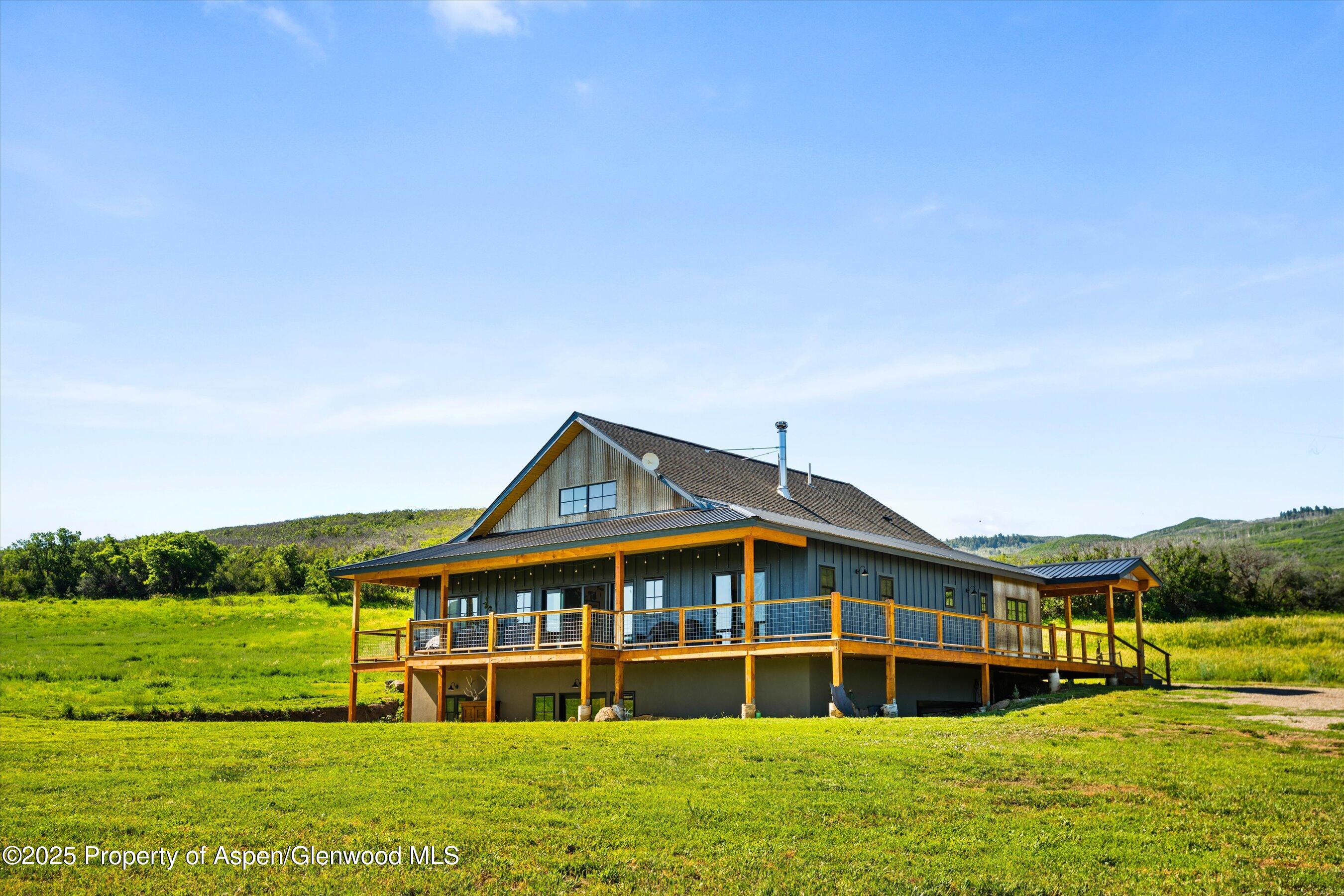 7315 County Road 312 New Castle, CO 81647 - Photo 3 of 75 a front view of a house with a yard