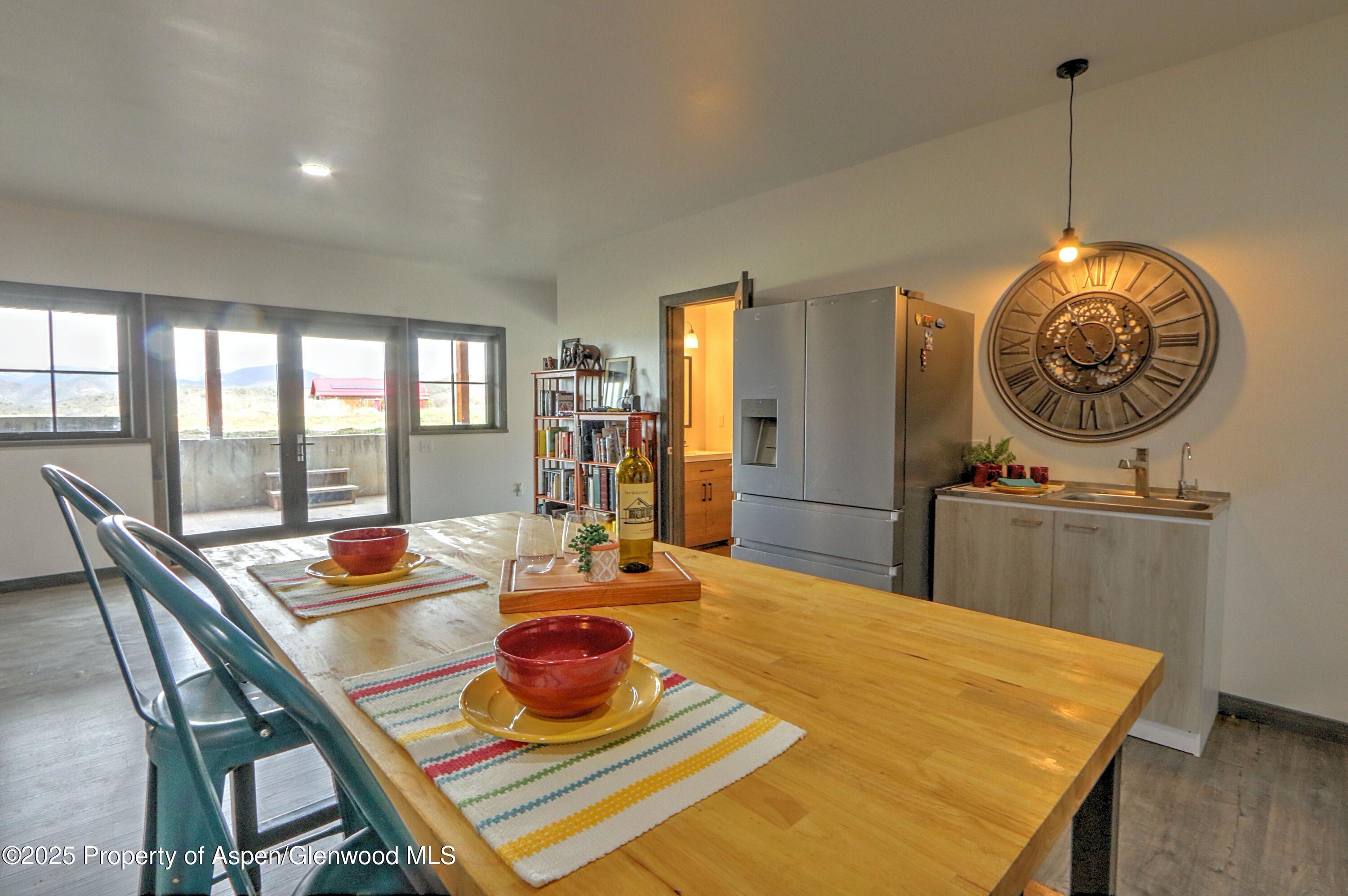 7315 County Road 312 New Castle, CO 81647 - Photo 31 of 75 a dining room with furniture a window and wooden floor