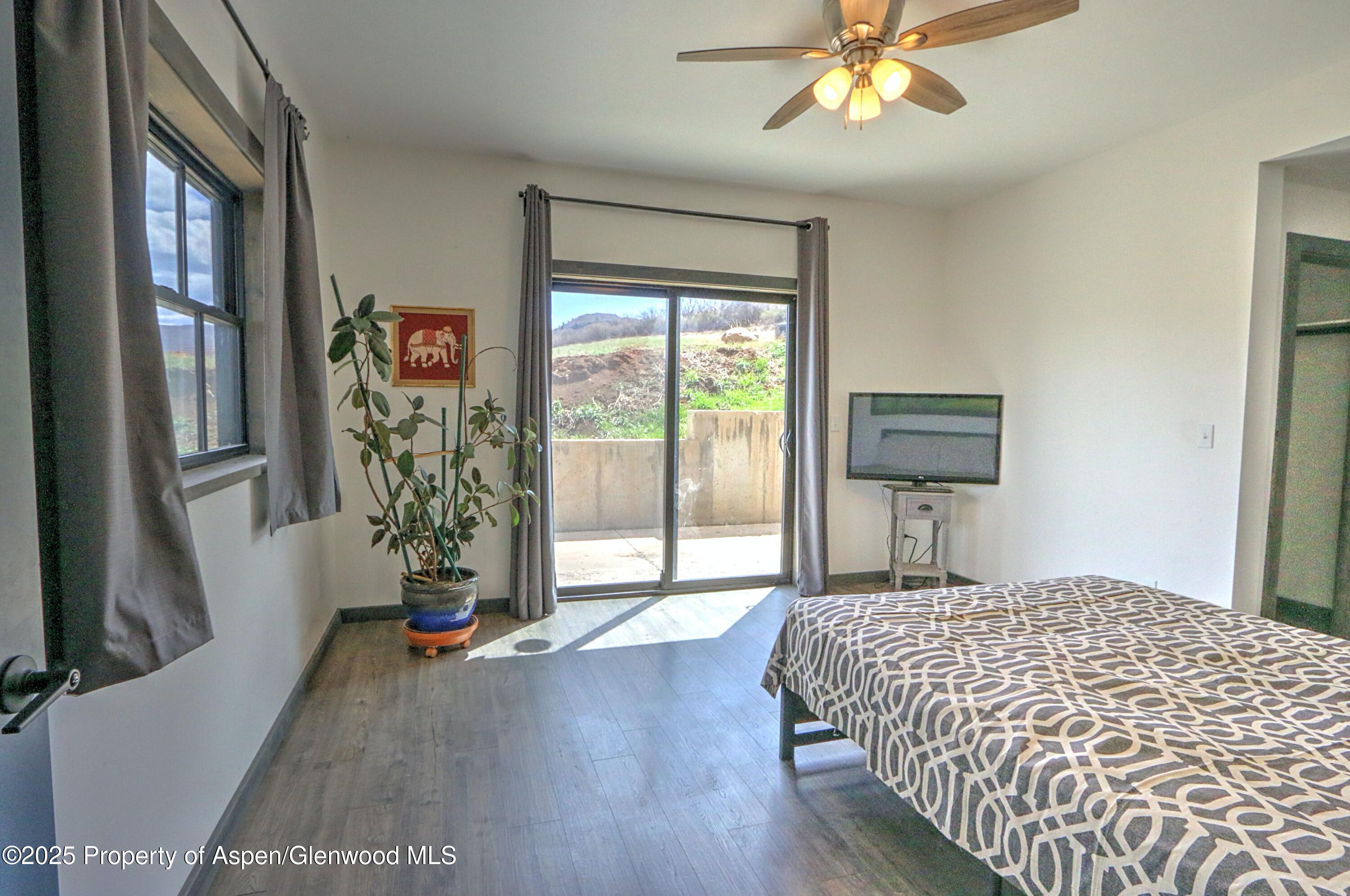 7315 County Road 312 New Castle, CO 81647 - Photo 35 of 75 a bedroom with a bed and a flat screen tv