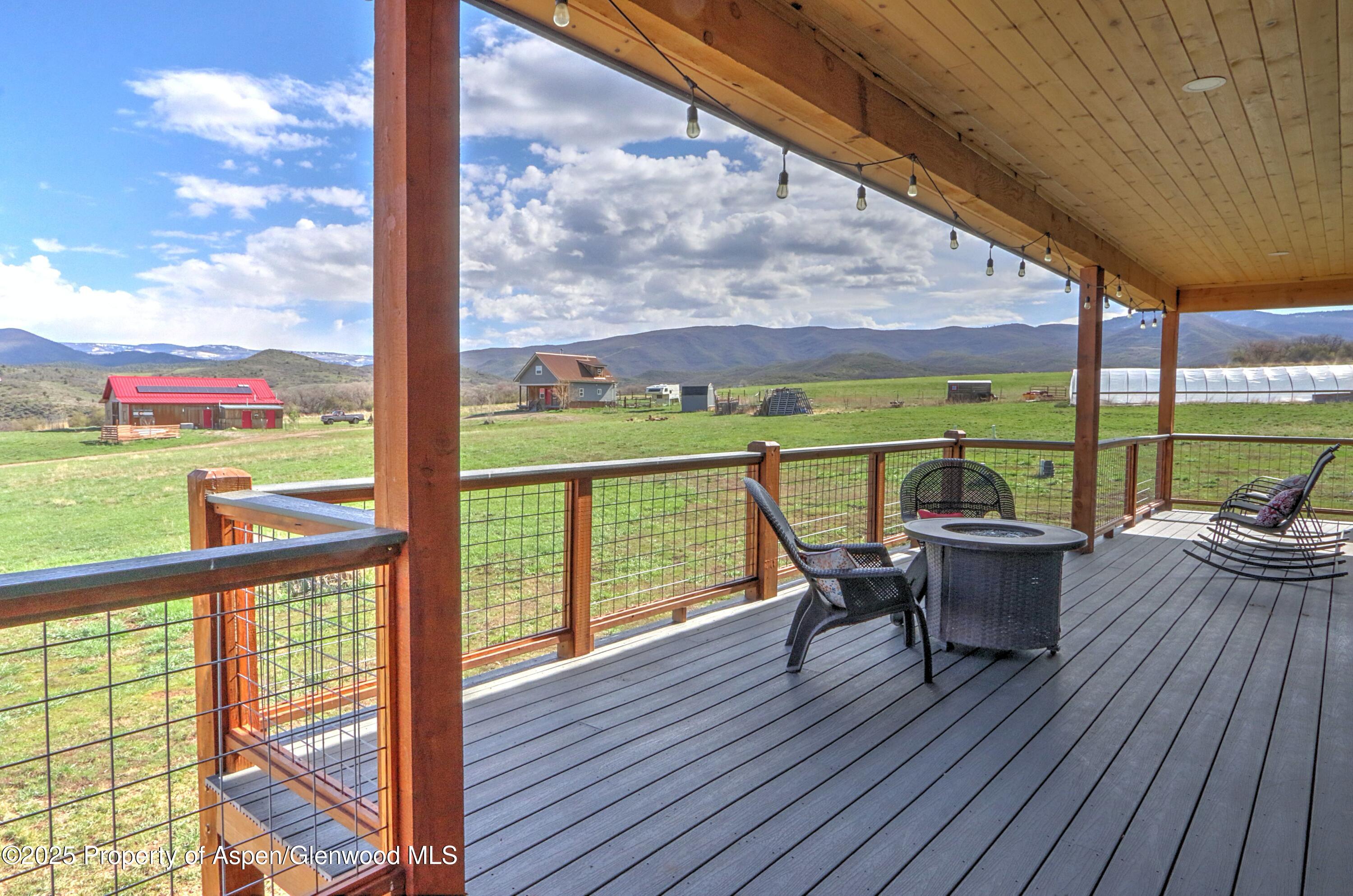 7315 County Road 312 New Castle, CO 81647 - Photo 39 of 75 a view of a deck with wooden floor and outdoor seating