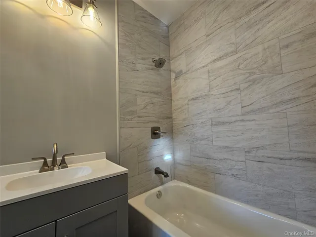 a bathroom with a sink and a bathtub