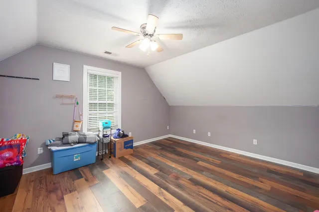 a room with gym equipment and a window