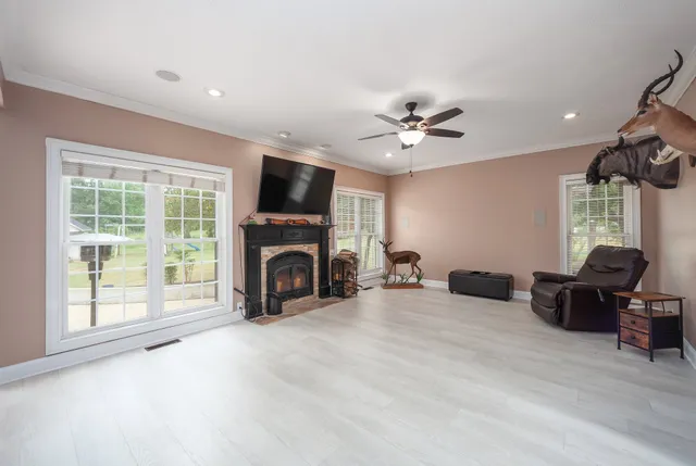 a view of livingroom with furniture workspace and a window