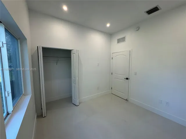 an empty room with closet