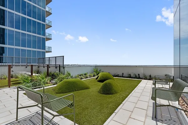 a view of a lake with couches and city view
