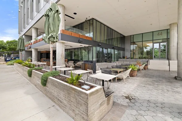 a view of a patio with a table and chairs