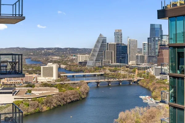 a kitchen with stainless steel appliances granite countertop a stove and a large refrigerator