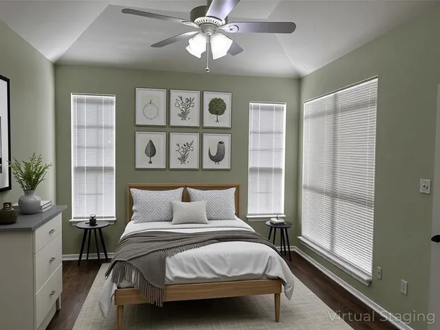 a bedroom with a large bed and a window