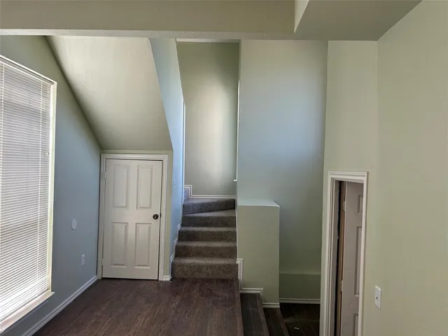 a view of entryway with wooden floor