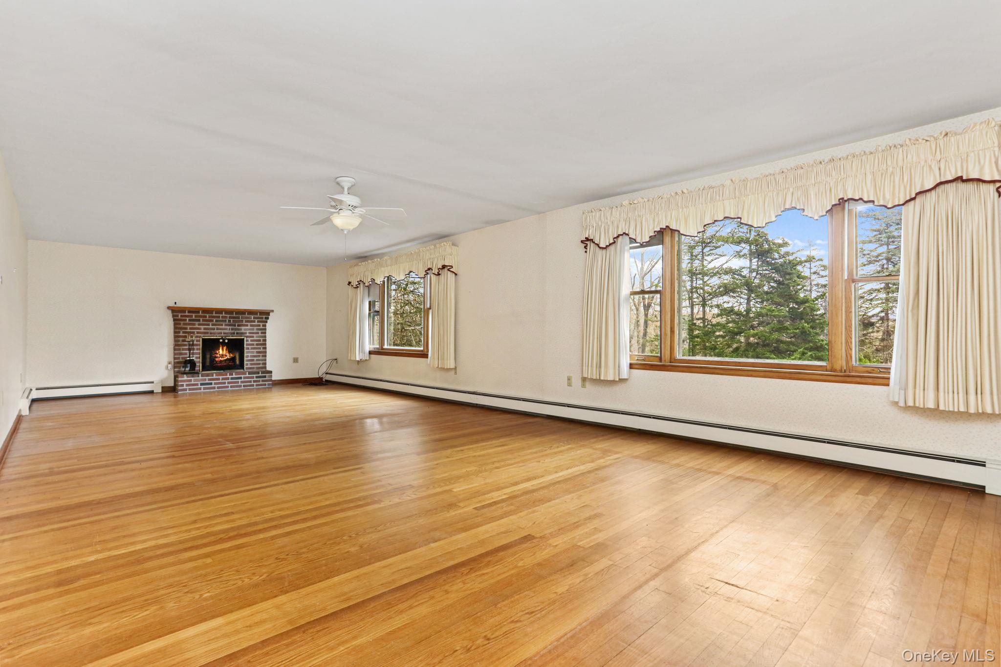770 Gahbauer Road Hudson, NY 12534 - Photo 4 of 39 a view of an empty room with window and wooden floor