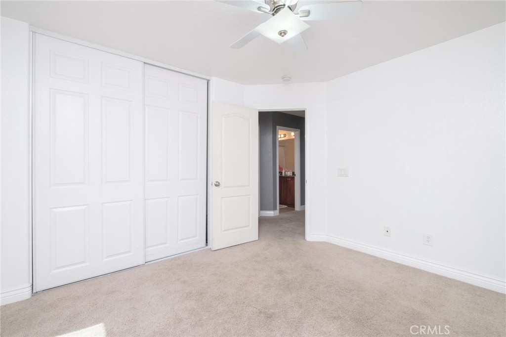 7940 Shadow Trails Lane Jurupa Valley, CA 92509 - Photo 17 of 34 an empty room with a ceiling fan